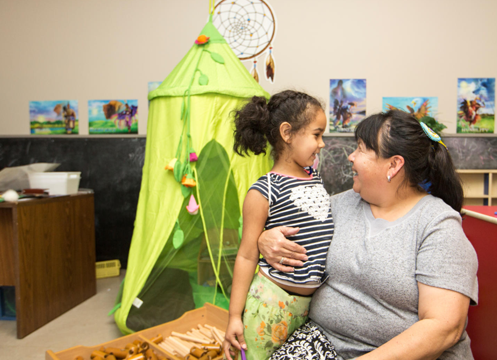 Young girl with a child care worker