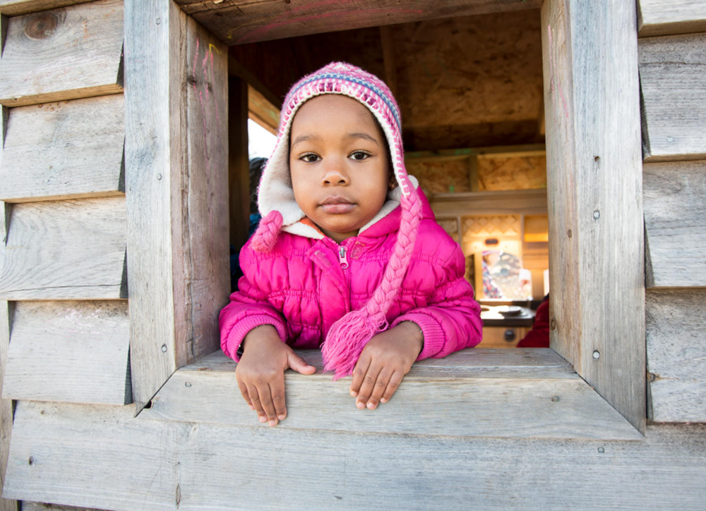 Little girl in a playhouse