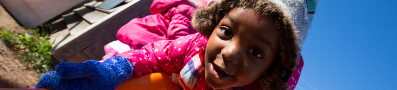 Little girl on a slide