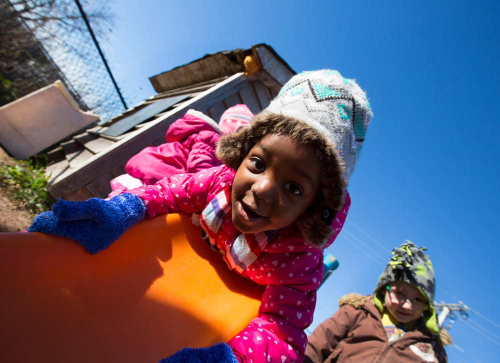 Little girl on a slide