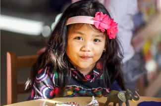 Little girl with a pink bow.